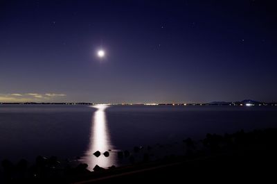 Scenic view of sea against sky at night