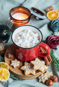 Cozy winter and christmas setting with hot cocoa and homemade cookies