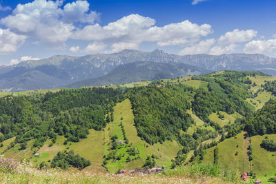 Scenic view of landscape and mountains against sky