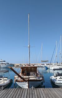 Boats moored at harbor