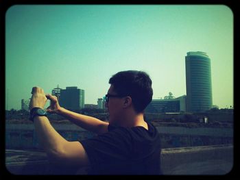 Woman photographing through camera