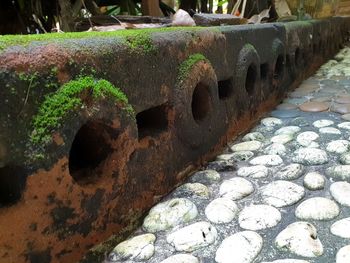 High angle view of rusty metal on rock