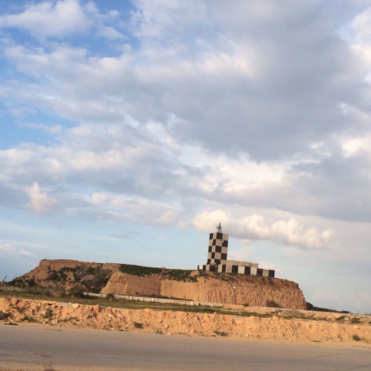 sky, cloud - sky, history, architecture, built structure, cloudy, cloud, old ruin, famous place, travel destinations, the past, ancient, travel, tourism, building exterior, tranquility, rock - object, rock formation, day, nature