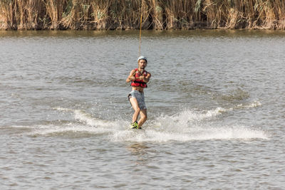 Full length of man enjoying in sea