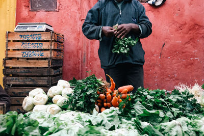 Full length of man standing at market stall