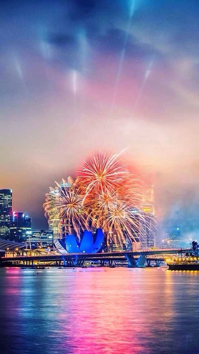 architecture, waterfront, built structure, water, illuminated, sky, building exterior, river, city, sunset, reflection, cloud - sky, connection, cityscape, bridge - man made structure, night, multi colored, dusk, orange color, no people