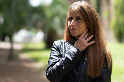 Portrait of woman standing outdoors