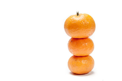 Close-up of oranges against white background