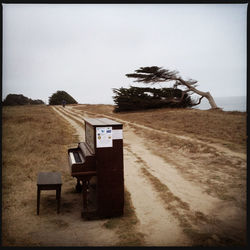 Empty bench against the sky