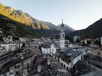 High angle view of buildings in town against sky