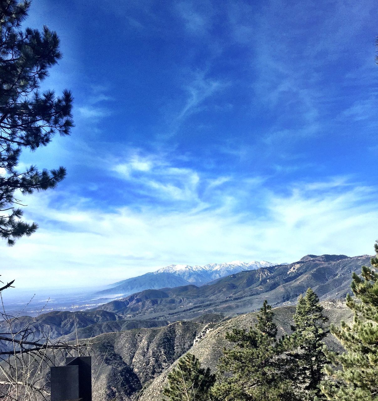 mountain, sky, mountain range, landscape, scenics, tranquil scene, blue, tranquility, tree, beauty in nature, built structure, cloud - sky, architecture, cloud, nature, building exterior, day, non-urban scene, outdoors, no people