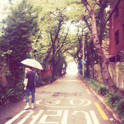 Woman walking on road