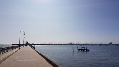 Pier over sea against sky