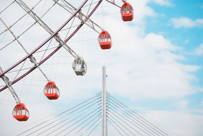 Low angle view of red lanterns hanging against sky