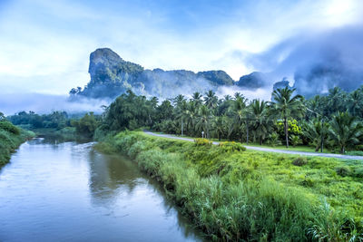 Scenic view of waterfall against sky