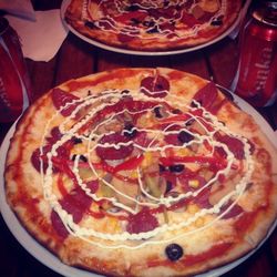 Close-up of pizza served on table