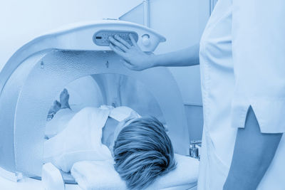 High angle view of woman washing hands in bathroom