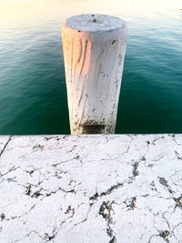 High angle view of wooden post in lake