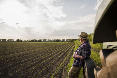 Farmer standing at a field