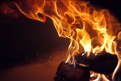 Close-up of fire burning at night