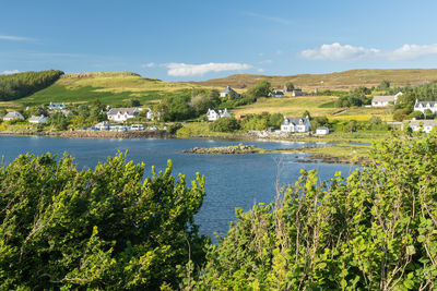 Scenic view of dunvegan village, isle of skye, on beautiful sunny summer day. scottish village 