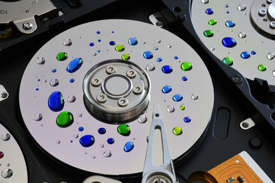 High angle view of colorful drops on hard drives