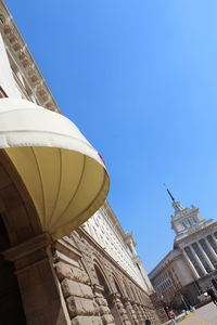 Low angle view of buildings against blue sky