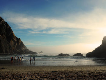 Scenic view of beach against sky during sunset