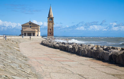 Madonna dell'angelo sanctuary church and blue sky in background at caorle - the little venice