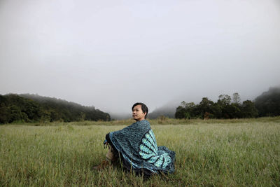 Man sitting on field