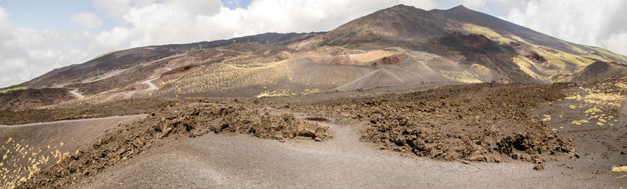 Panoramic view of volcanic landscape against sky