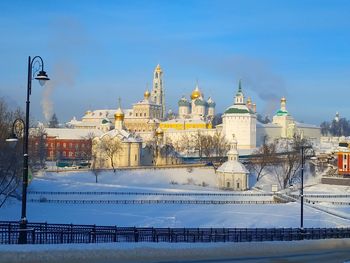 Buildings against sky during winter