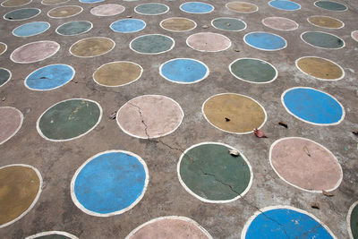 Full frame shot of colorful circle shapes painted on footpath