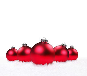 Close-up of christmas decorations over white background