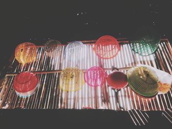 Low angle view of candies on glass table