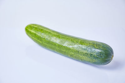 Close-up of green pepper against white background