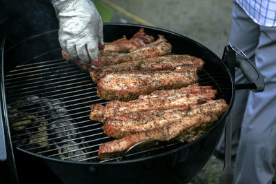 High angle view of meat grilling on barbeque grill