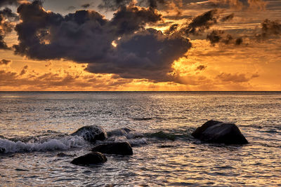 Scenic view of sea against sky during sunset