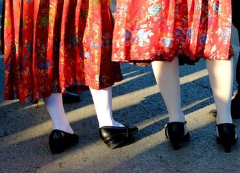 Low section of women standing on floor