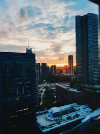 Cityscape against sky during sunset