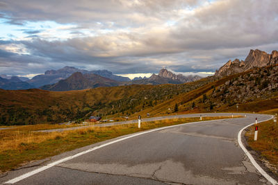 View of road at mountains against sky