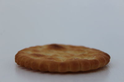 Close-up of cake against white background