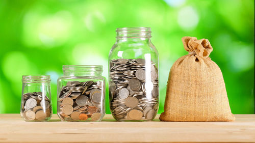 Close-up of coins in jar 