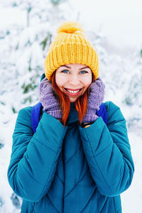 Portrait of young woman wearing warm clothes