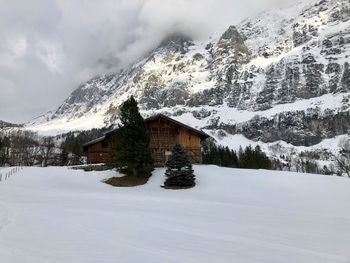 Scenic view of snow covered mountain against sky