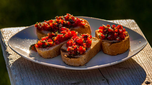 Close-up of food served in plate on table during sunny day