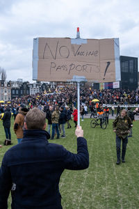 Rear view of people on street