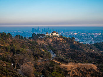 High angle view of buildings and sea against sky