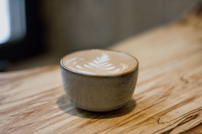 Close-up of coffee cup on table