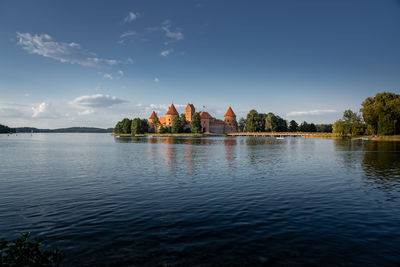 Scenic view of lake against sky during sunset